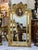 Add timeless European elegance to your interior with this ornate vintage-style wall mirror, featuring an intricately...