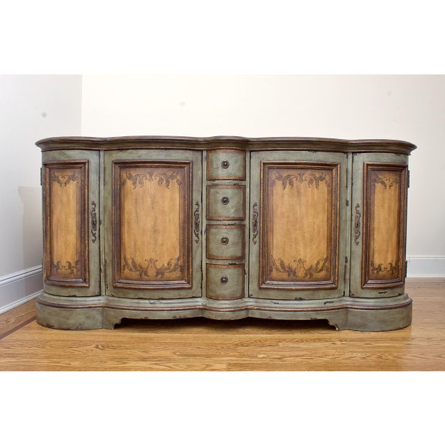 A contemporary painted buffet server cabinet server with ample storage by Henry Link. Product Information: Materials:...