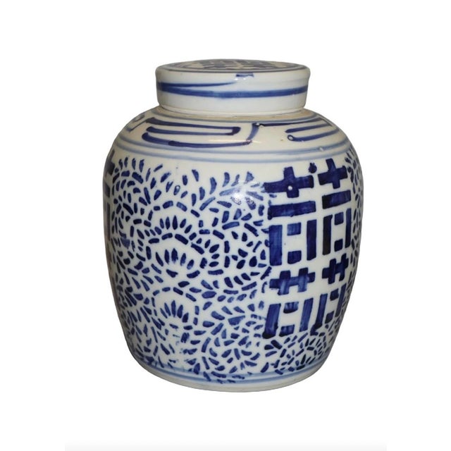 A classic staple for a well appointed interior, this vintage Chinese blue and white ginger jar with matching lid stands a...
