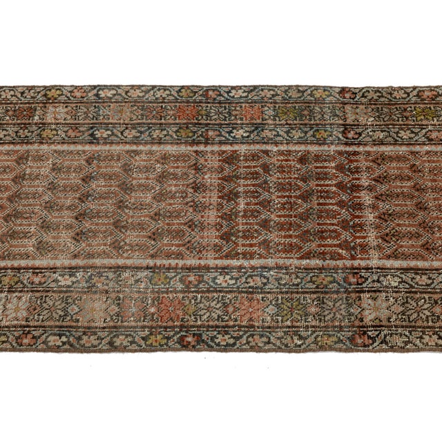 Elevate your interior with this exceptional 19th-century Antique Malayer runner rug, hand-knotted in fine natural wool....