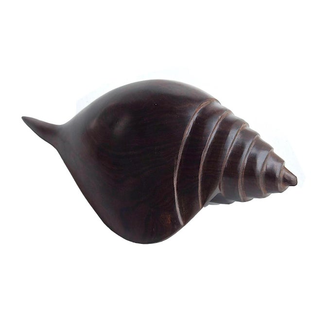 Offered is a stunning hand carved Ironwood conch sculpture/paperweight. It's a very buttery finish and buffed to a soft...