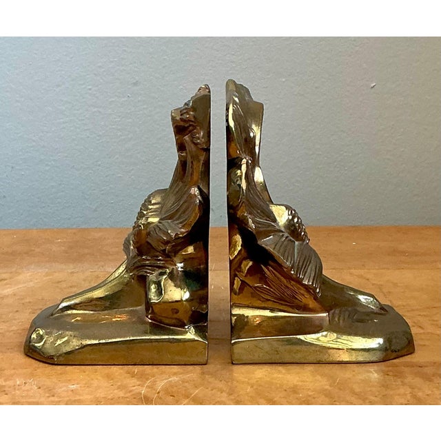 Bring timeless elegance and organic charm to your library or display with this pair of vintage solid brass pinecone...