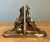 Bring timeless elegance and organic charm to your library or display with this pair of vintage solid brass pinecone...