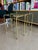 This vintage mid-century modern set of two nesting tables, designed circa 1970, features structural elements reminiscent...