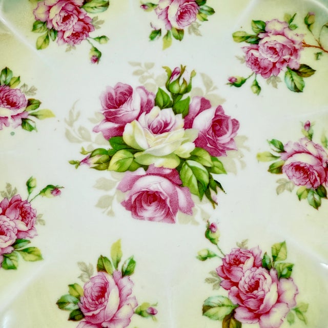 A porcelain plate with pink roses and a gilded beaded border, by M&Z, Austria, circa 1900. “M&Z Austria” porcelain was...