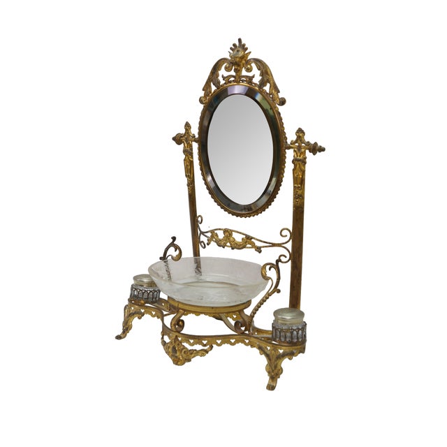 Rare antique French Victorian vanity mirror. Made of gilded bronze featuring Neoclassical and Rococo styling with an...