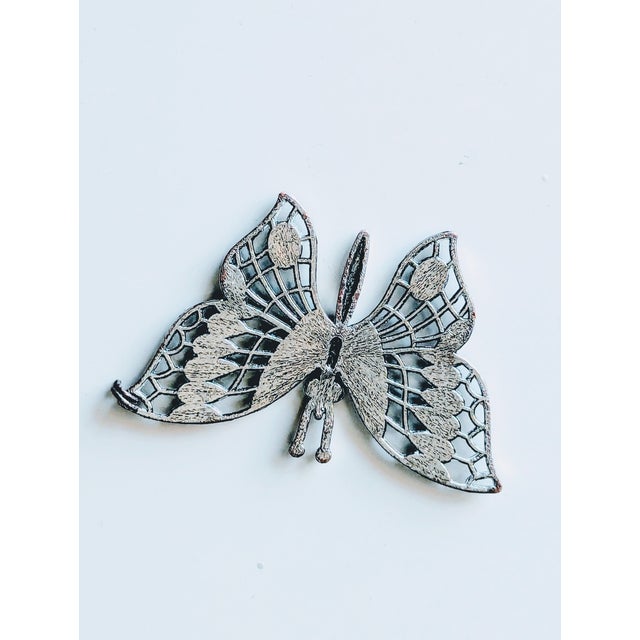 A none articulating, one sided rendition of the 70's Spanish Plique a Jour enamel brooch. The ribs under the head are...