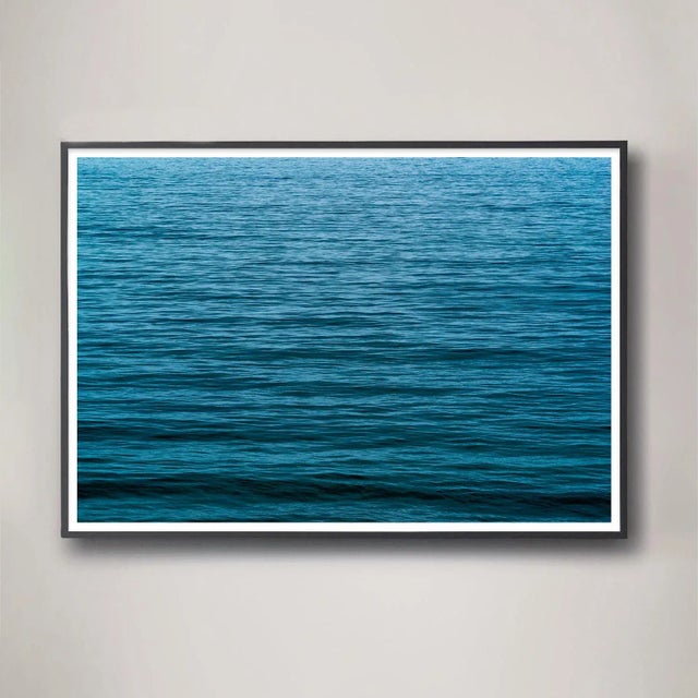 This large format photograph is saturated with deep blue color and a sense of scale that is both all-encompassing and...