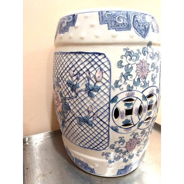 Large blue/white/pink Chinese ceramic garden stool or plant stand. One faint discoloration spot/area on side near top as...