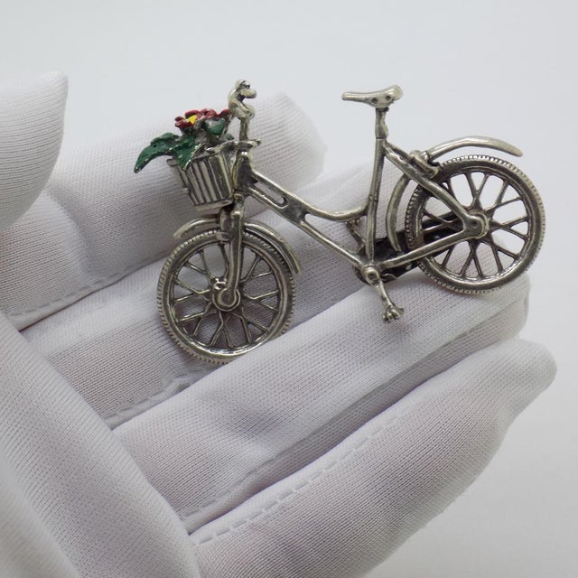 Delicate vintage miniature depicting a bicycle with a flower basket, handcrafted in Italy between the 1980s and 1990s in...
