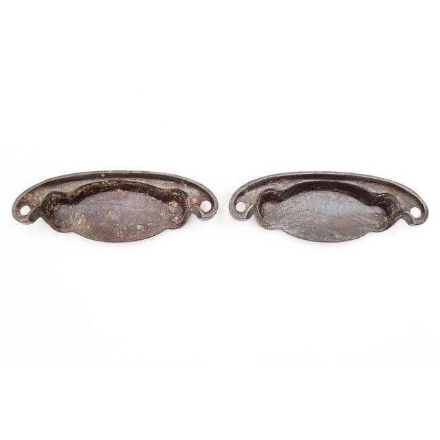 Victorian style cast iron bin drawer pulls with a black finish. The original mounting screws are not available. Good...