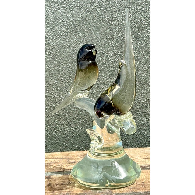 Embodying the timeless elegance of Italian glassmaking, this vintage "After Murano" sculpture features a pair of lovebirds...