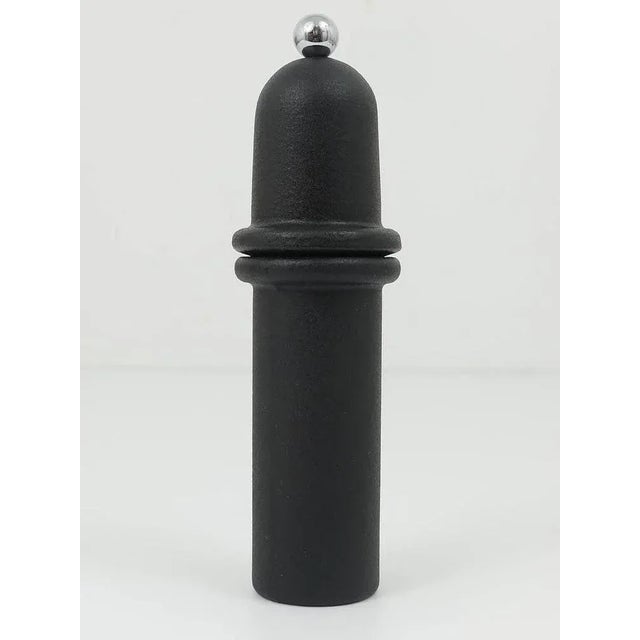 A beautiful and solid modernist pepper- or salt mill with Peugeot grinder, made of black-finished cast iron. Designed and...