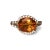 This fabulous estate ring is crafted in luxurious 18K white gold and features a vibrant oval orange citrine surrounded by...