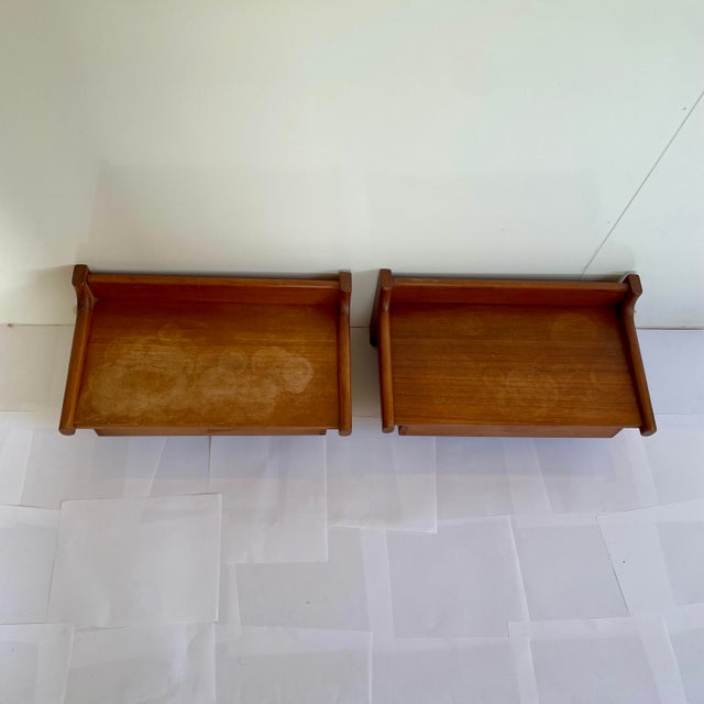A pair of vintage 1960’s nightstands . The wall mounted bedside tables were commonly produced in the 1950’s and 60’s and...