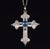 This is a gorgeous natural sapphire and diamond cross pendant crafted in solid 18K white gold. This luxurious pendant...