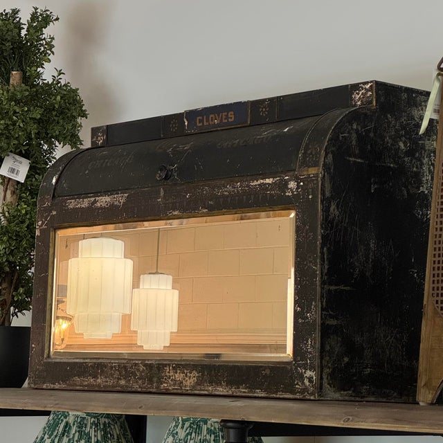 Charming antique advertising mirror cabinet featuring original “Cloves” lettering and beautifully worn black painted...