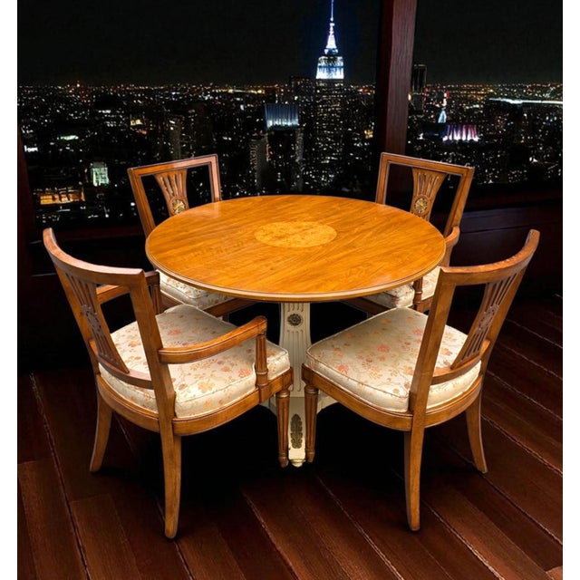 This Vintage Henredon Breakfast Table & Chairs is a gorgeous fusion of neoclassical elegance and modern practicality....