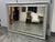 Design Plus Gallery presents a Contemporary Silver Tone Fluted Rectangular Wall Mirror. The rectangular mirror is framed...