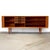 Dimensions: 79 1/2" L x 19 1/8" D x 31 1/2" H Origin: Faarup, Denmark Designer: Svend Aage Larsen Manufacturer: Faarup...
