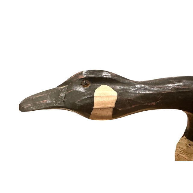 A lovely, vintage wood goose decoy. Features a hand carved, Canadian goose decoy in a rare swimming form. Hand painted...
