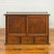 An antique Japanese keyaki wood buffet from the 19th century, with sliding doors and three drawers. Crafted in Japan...