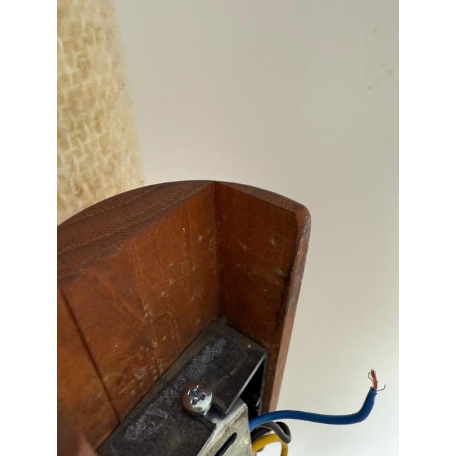 This beautiful wall lamp made up of solid teak wall lamp with a wool lampshade is a rare find. Its simple, timeless design...