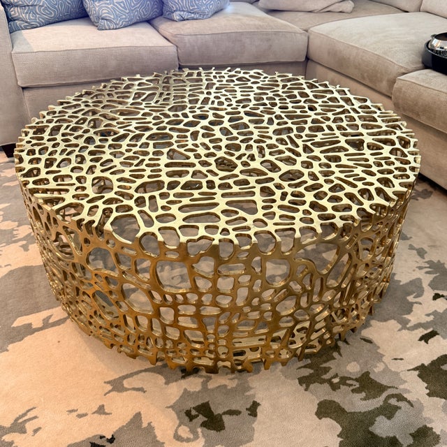 Una Cocktail Table by Ironies We love the cool effect of this openwork pattern. The vibrant brass finish is eye-catching...
