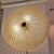 Semi-spherical wall sconce crafted from Murano glass with a fluted surface that curves towards the center, is slightly...