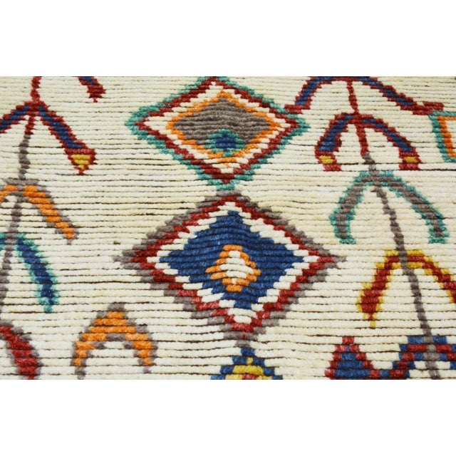 Hand-knotted with care using traditional rug-making techniques, this wool rug blends timeless craftsmanship with a modern...