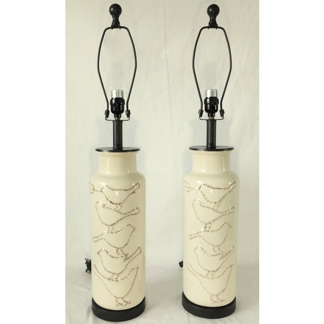 Wonderful Pair of vintage beige ceramic crackle with brown figural birds. Harps and finials included. No shades. Work...