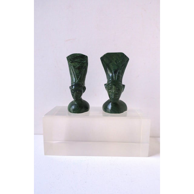 African marble sculptures on Lucite base, circa late-20th century. Green carved marble female and male head bust...