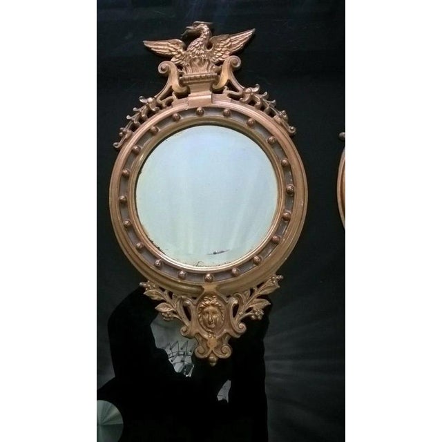 A striking pair of antique Victorian cast iron mirrors, dating precisely to 1892 and distinguished by their highly...