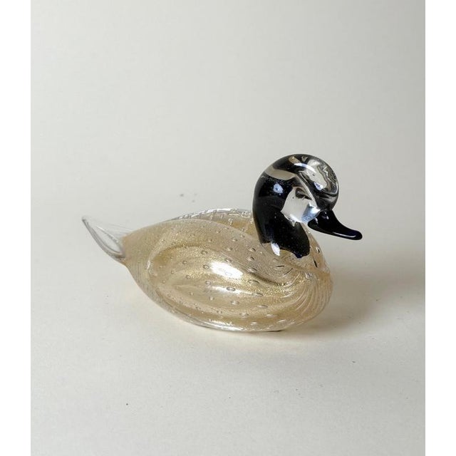 A charming and finely crafted Italian Murano art glass duck sculpture, dating from approximately the 1970s. The stylized...
