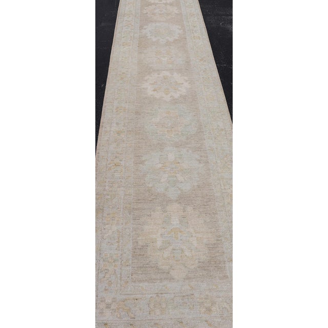 Long Soft Oushak Runner With Sand Field and Pale Green and Blue Accents For Sale - Image 10 of 12
