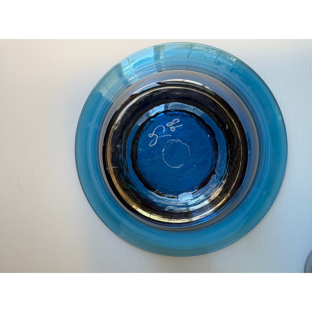 Beautiful 3 piece art glass bowl set in blue. Hand blown with artist signature on each piece. Excellent condition.