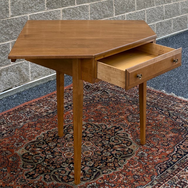 A vintage Dearborn Furniture of Provincetown American Traditional solid maple corner desk having one dovetailed drawer...