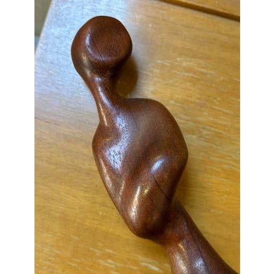 Abstract Teak carving of the female figure. Nicely done. Overall nice shape and tone to wood.