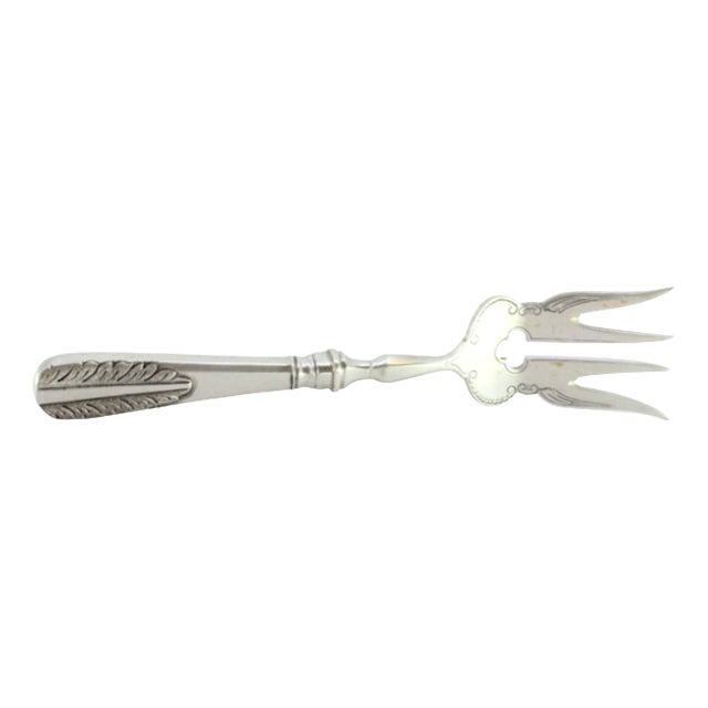 Silver Fish Serving Fork with Floral Motifs in Relief on the Handle For Sale