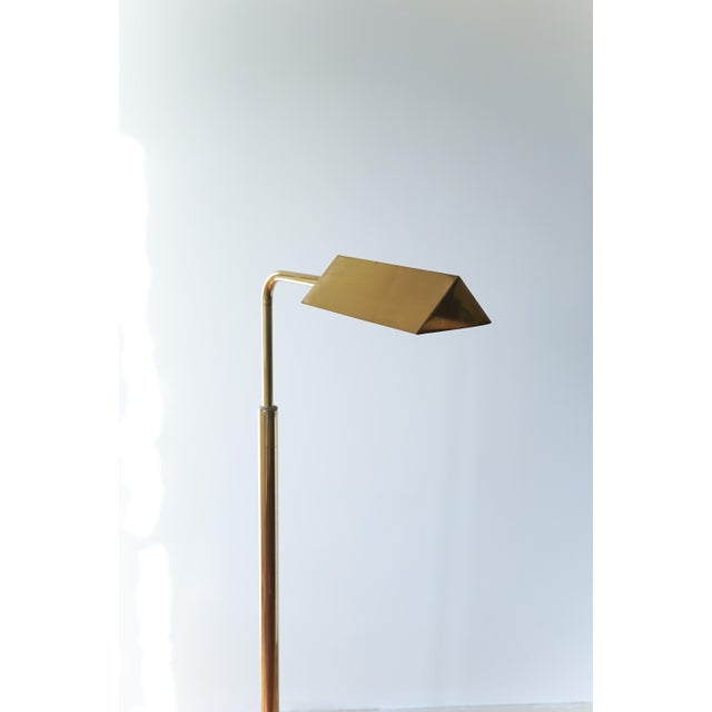 A simple elegant floor lamp by the Belgian company Belgo Chrom. It contains a small footswitch in a matching colour with...