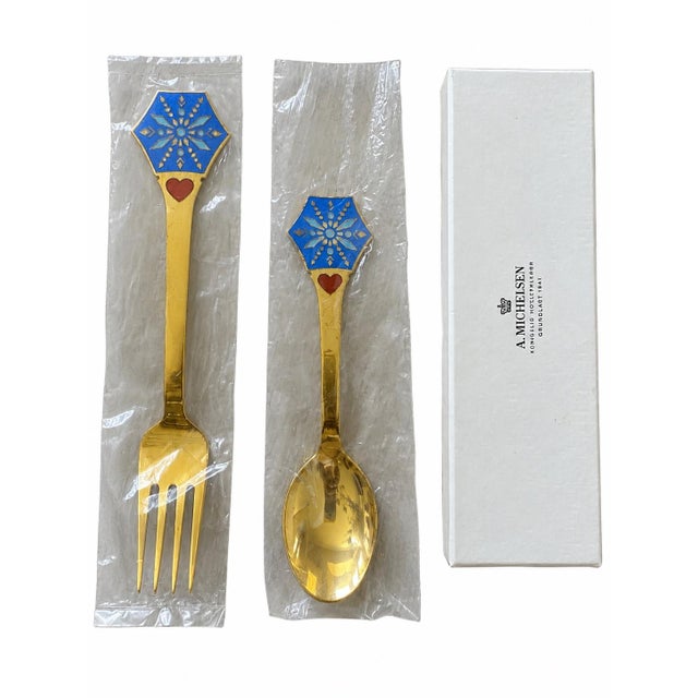 A beautifully crafted 1976 Christmas spoon and fork by A. Michelsen, Copenhagen, designed by Gudmund Olsen. Executed in...