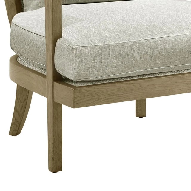 Modern Armchair, a modern solid oak accent chair with brown leather cord wrapped around the exposed wood back in the light...