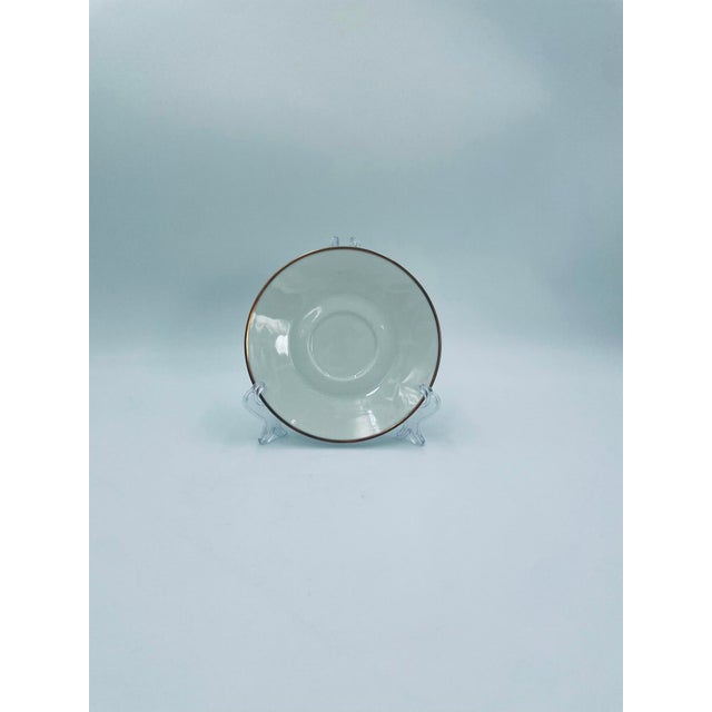 A teacup saucer from the renowned Rosenthal brand, from the Form 2000 line, crafted from high-quality white porcelain. The...