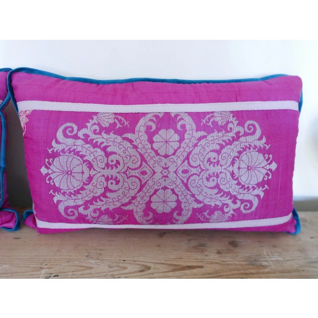 Amazing silk pillows with Samuel and Sons tape trim and blue-green velvet flange. Pillows have down inserts and zippered...