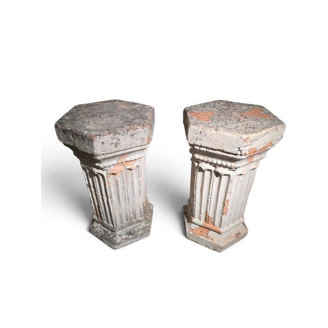 An elegant and highly decorative pair of 19th-century Italian hexagonal terracotta pedestals, beautifully conceived in the...