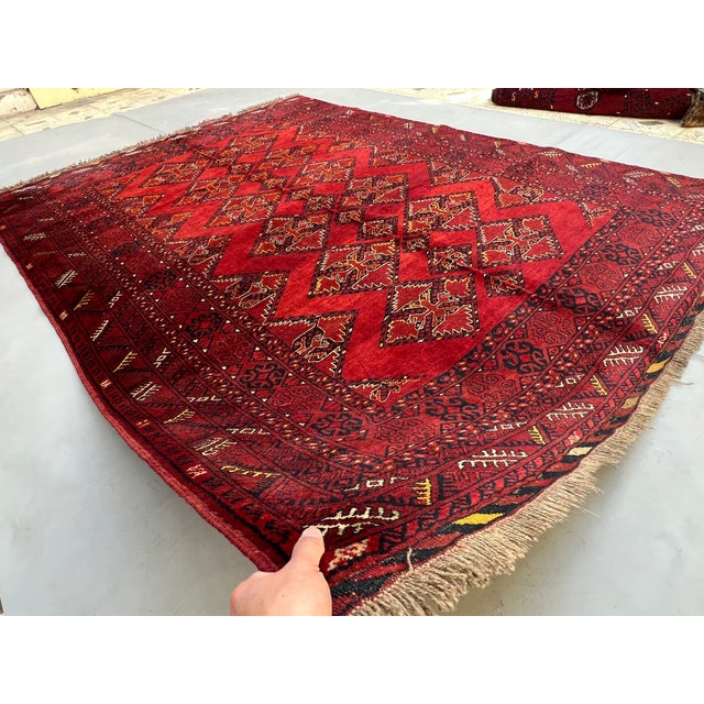 A commanding vintage Afghan Ersari Khamyab tribal rug — three large stepped-lozenge diamonds in bold vertical chain...