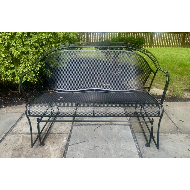 MCM vintage cast iron mesh glider bench. Woodard replica. Excellent condition glider bench. It is great for a patio or...