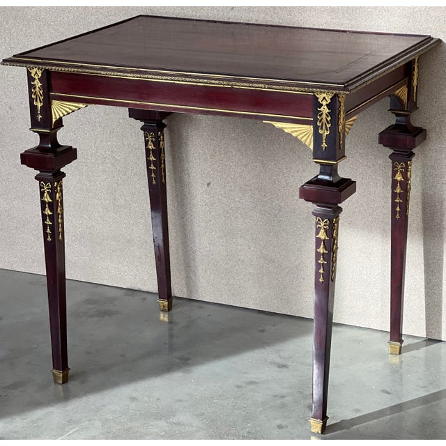 A very fine French 19th-20th century Louis XVI style mahogany and gilt bronze (Ormolu) mounted guéridon side table in...