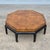This is a glamorous Asian style octagonal coffee table with a beautifully grained burlwood top and a black lacquered base...