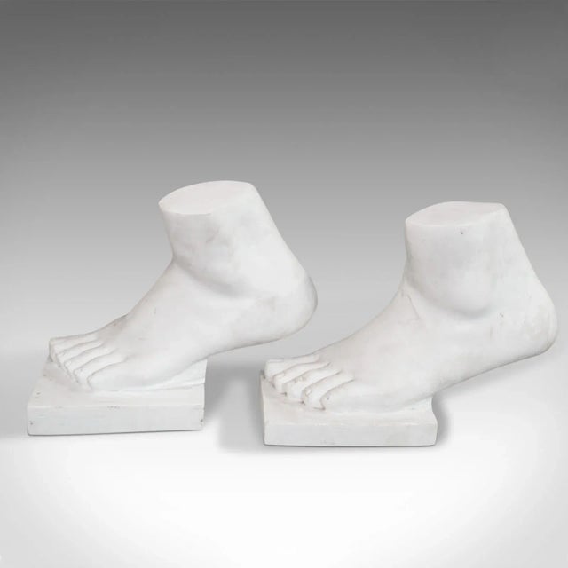 Strictly Two Left Feet' is a pair of vintage ornamental bookends. An English, statuary marble decorative ornament dating...